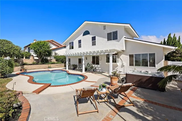 a front view of a house with swimming pool