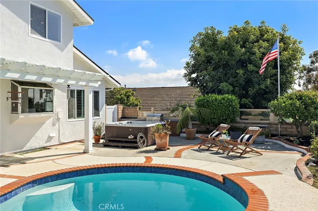 a view of a house with pool porch and furniture