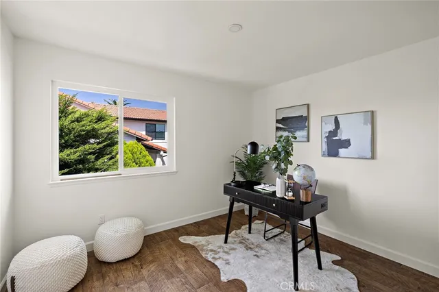 a workspace with furniture and a potted plant
