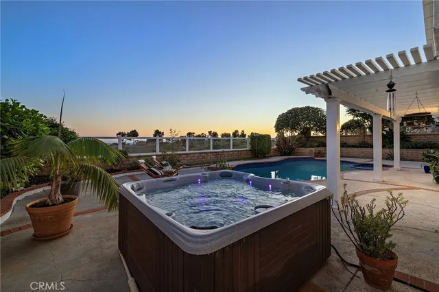 a view of a patio with a table and chairs
