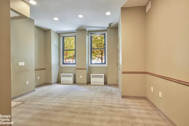 a bathroom with a sink a vanity and a large mirror