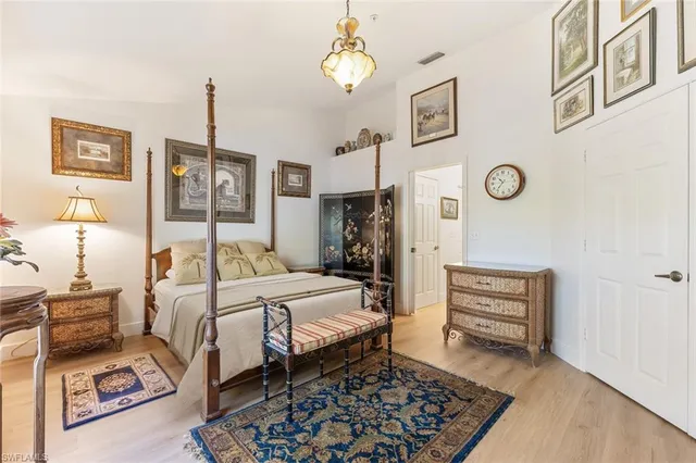 a bedroom with a bed dresser and a window