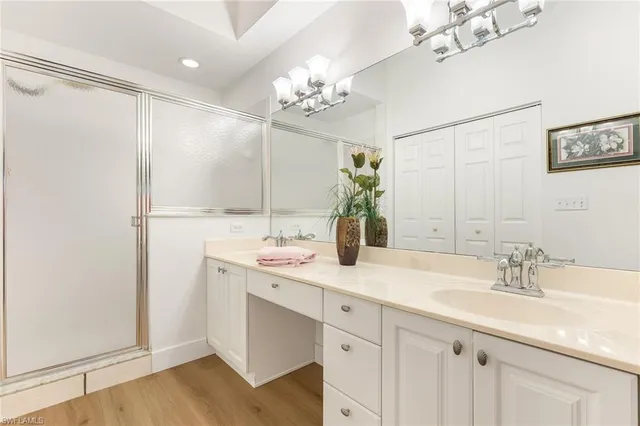 a bathroom with a sink double vanity and a mirror