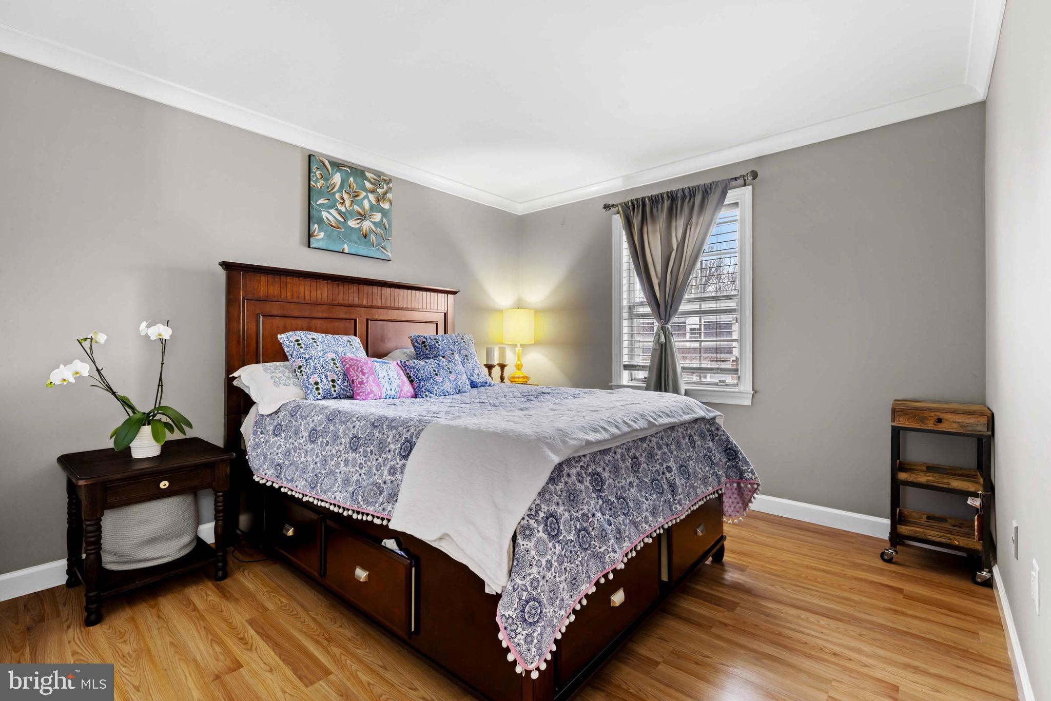 8610 Kelso Terrace Gaithersburg, MD 20877 - Photo 17 of 33 a bedroom with a bed and wooden floor