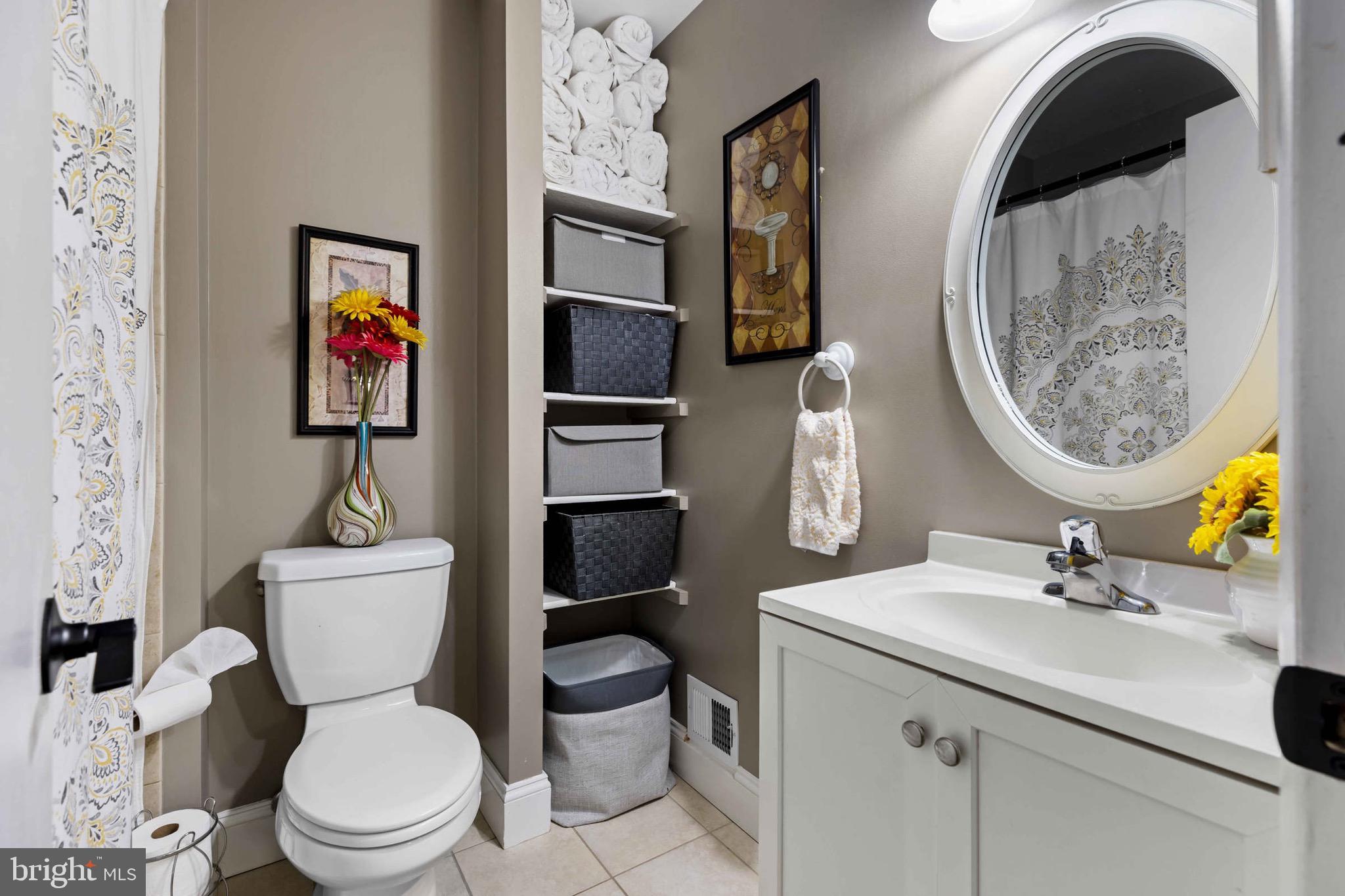 8610 Kelso Terrace Gaithersburg, MD 20877 - Photo 18 of 33 a bathroom with a toilet sink and mirror