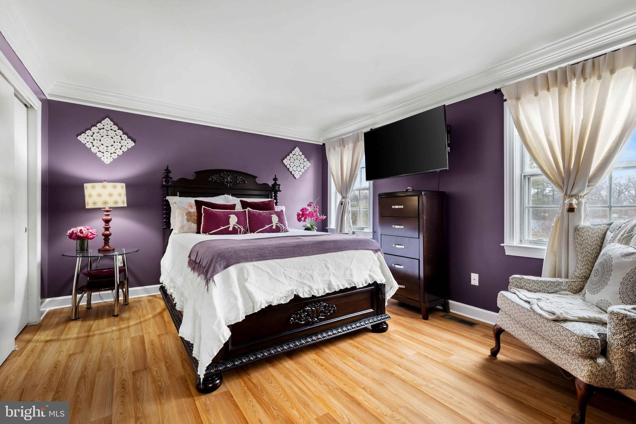 8610 Kelso Terrace Gaithersburg, MD 20877 - Photo 19 of 33 a bedroom with a bed and flat screen tv