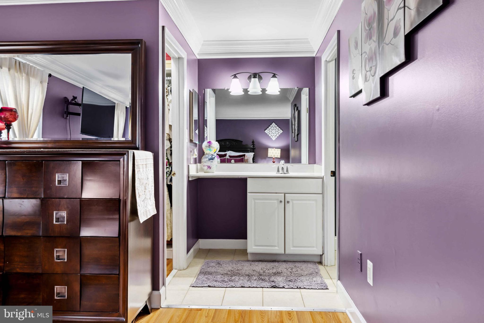 8610 Kelso Terrace Gaithersburg, MD 20877 - Photo 20 of 33 a view of hall way with mirror and cabinet
