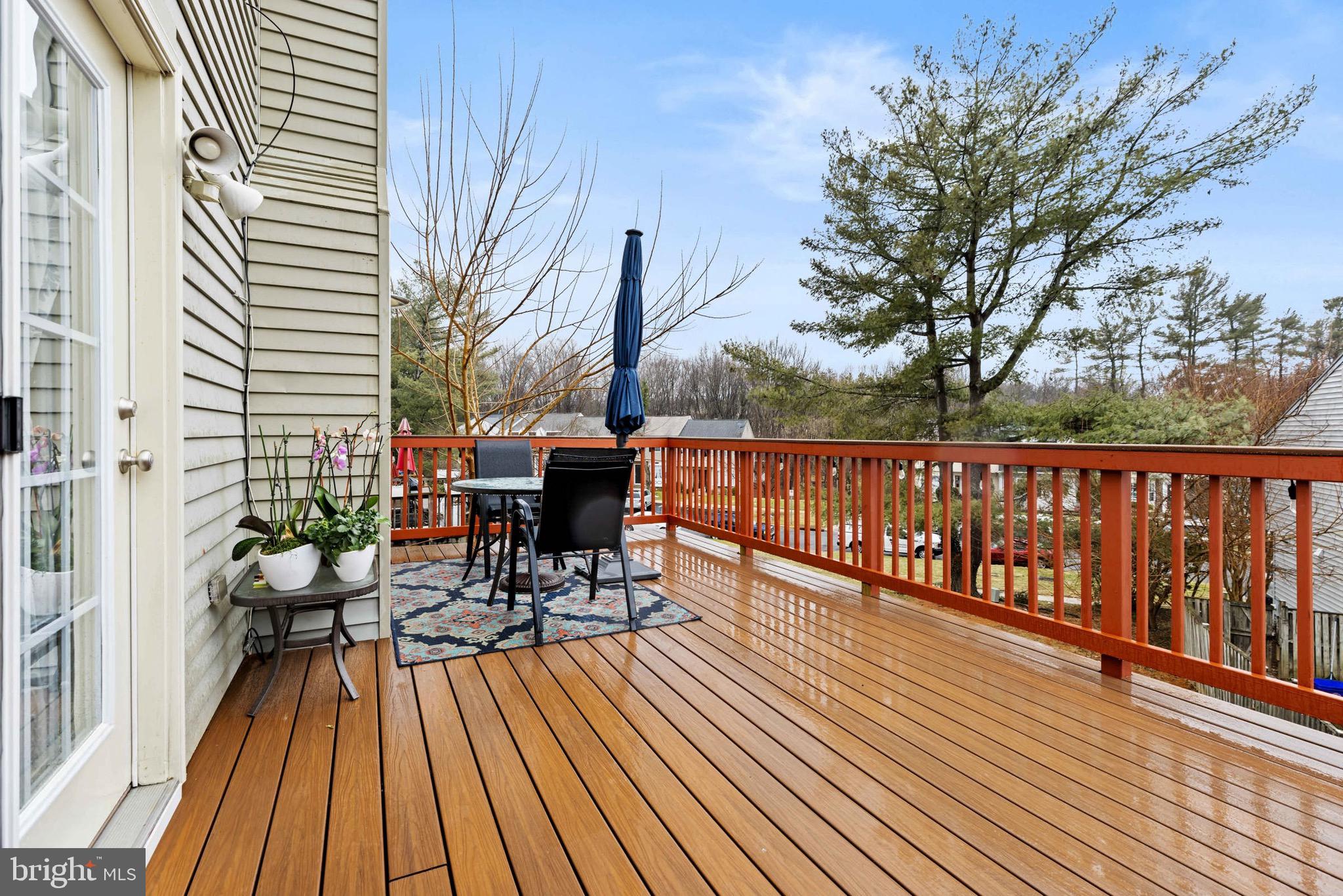 8610 Kelso Terrace Gaithersburg, MD 20877 - Photo 24 of 33 a view of balcony with chairs and wooden floor