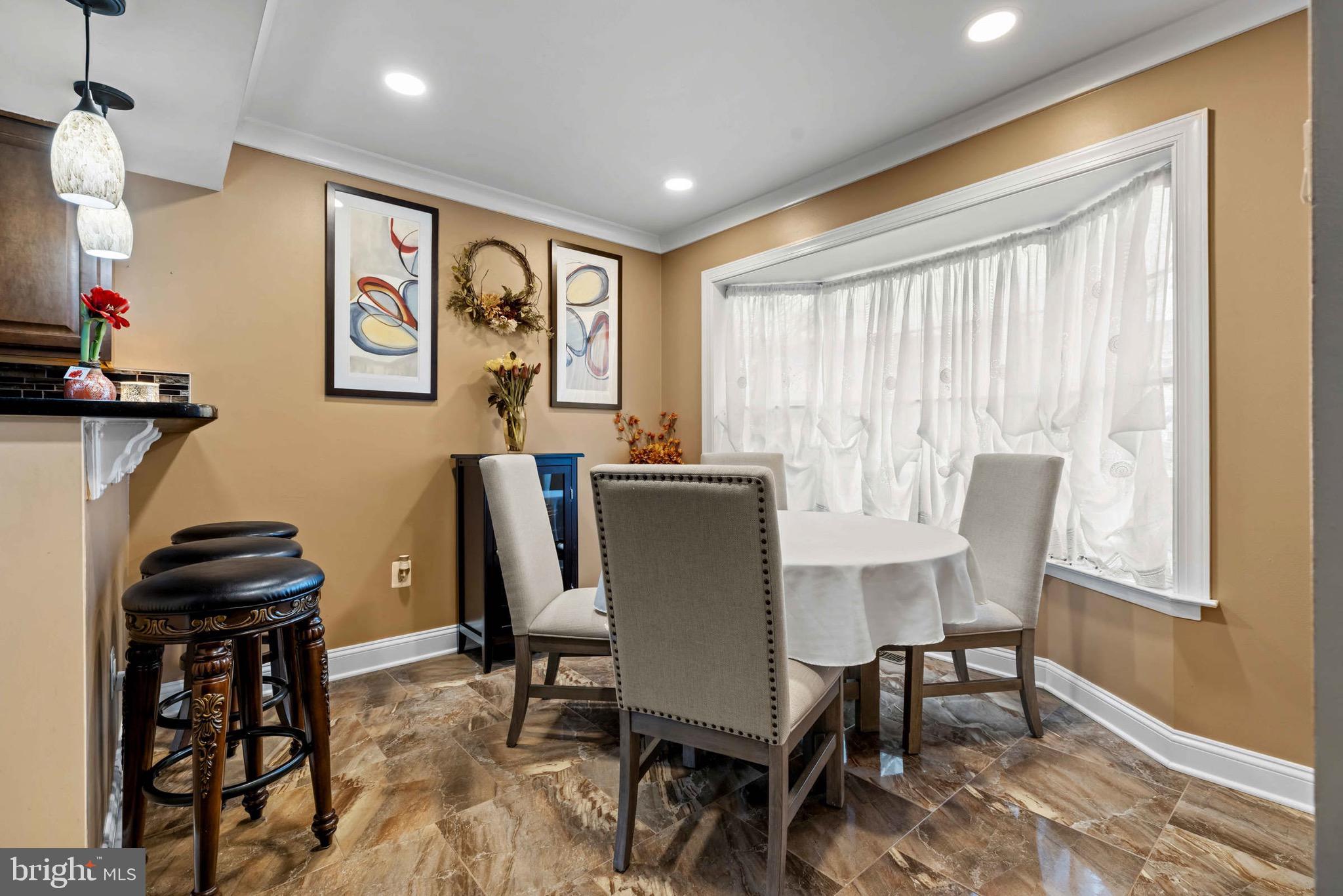 8610 Kelso Terrace Gaithersburg, MD 20877 - Photo 4 of 33 a view of a dining room with furniture window and outside view