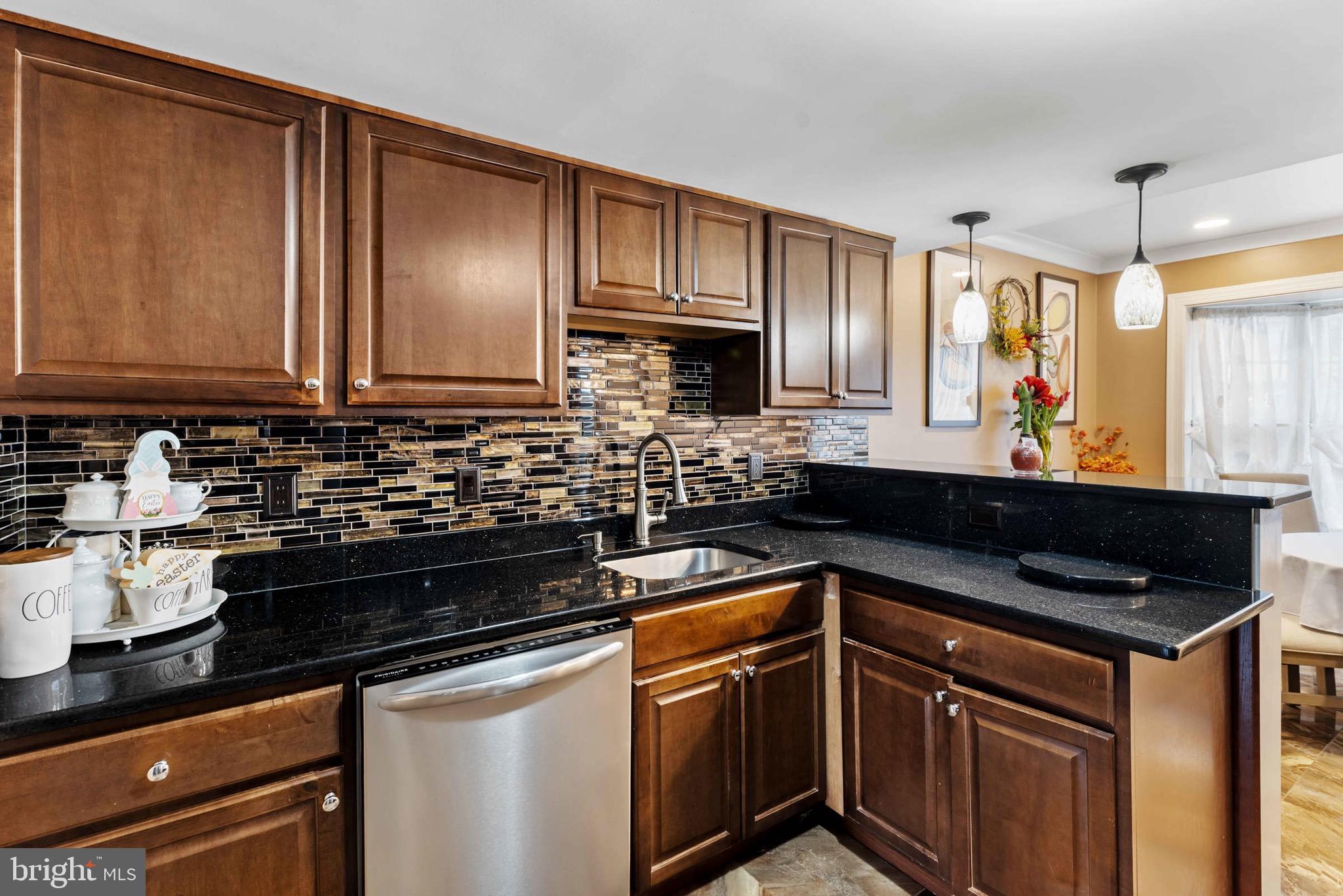 8610 Kelso Terrace Gaithersburg, MD 20877 - Photo 5 of 33 a kitchen with a sink and cabinets