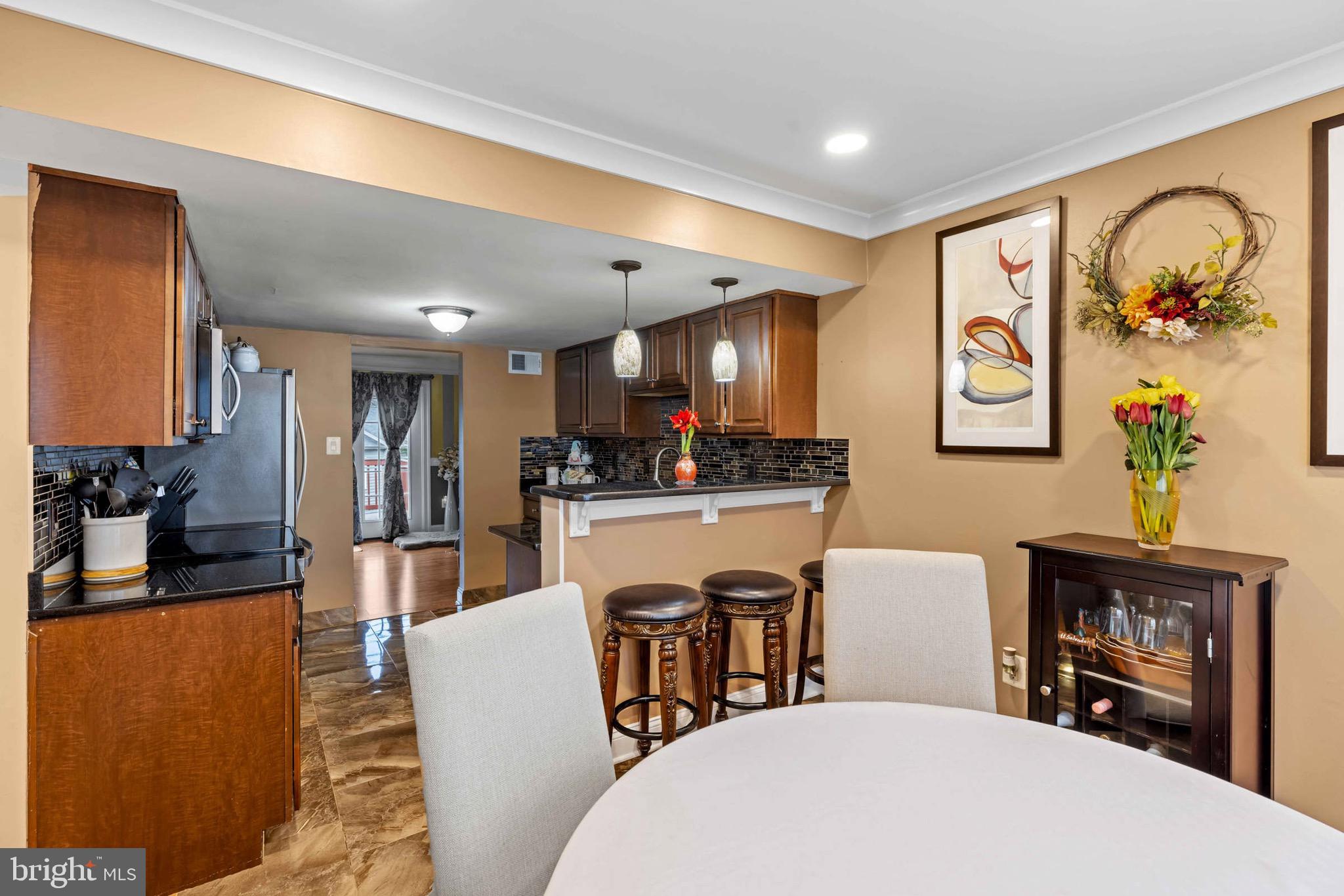 8610 Kelso Terrace Gaithersburg, MD 20877 - Photo 7 of 33 a living room with stainless steel appliances furniture a dining table and kitchen view
