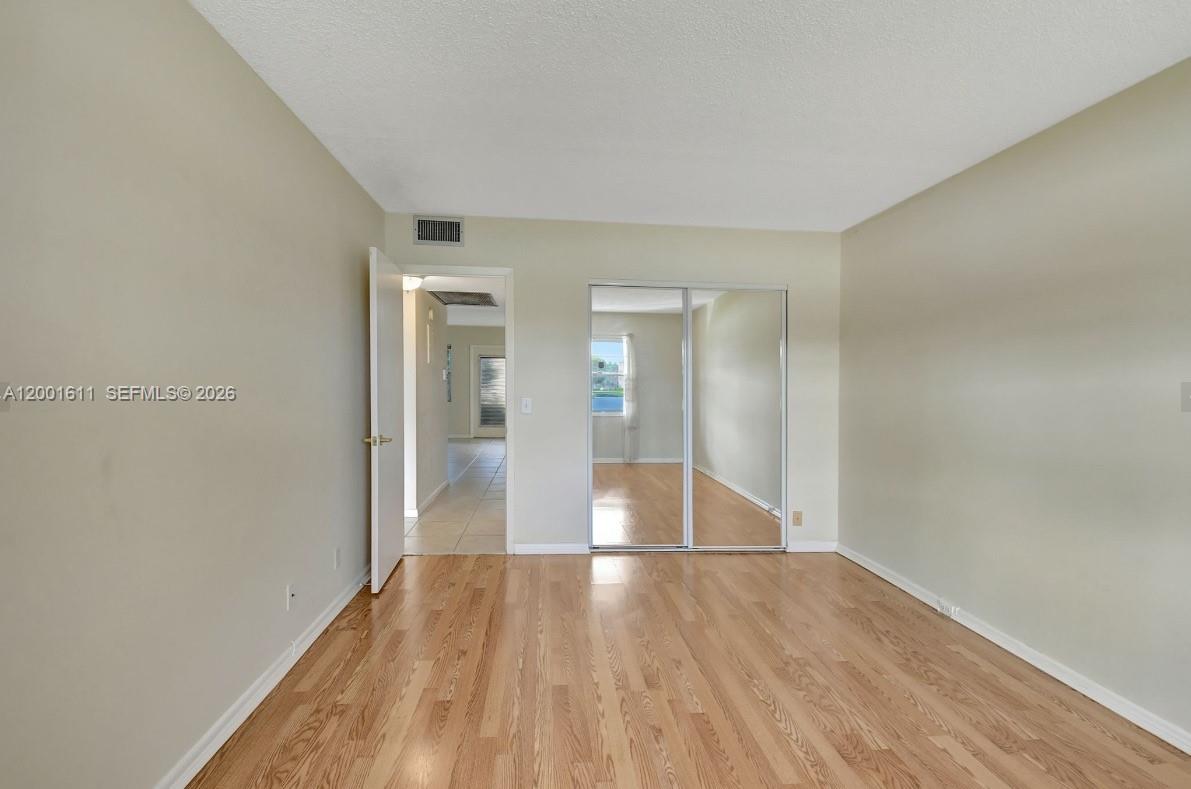 1020 Exeter, Unit 1020 Boca Raton, FL 33434 - Photo 5 of 15 a view of wooden floor in an empty room
