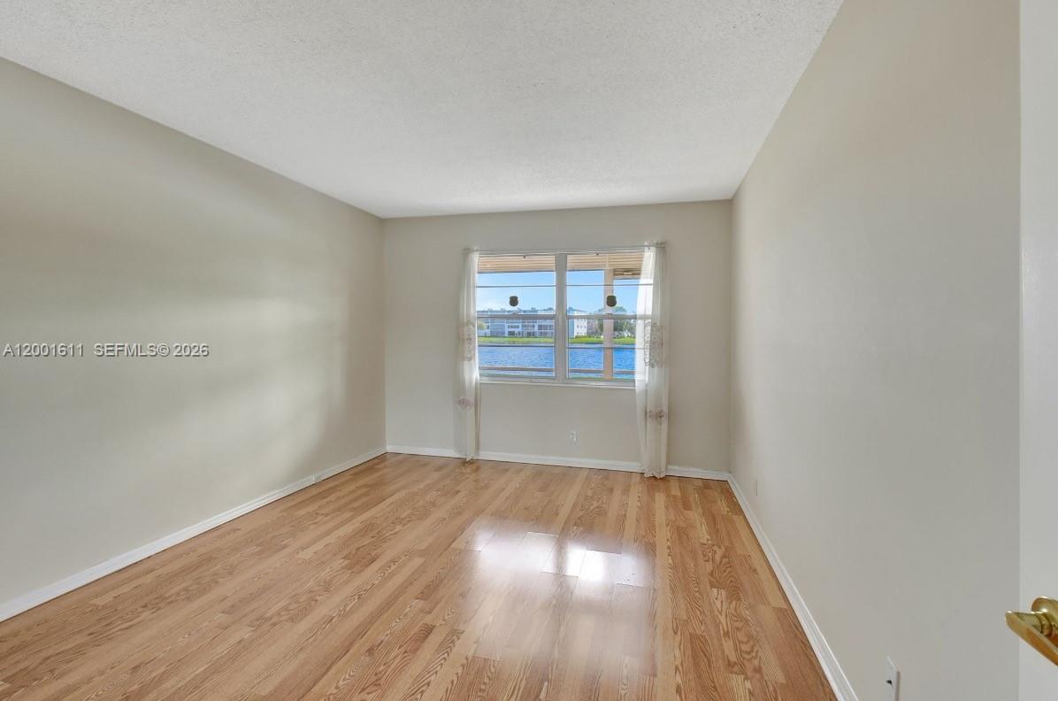 1020 Exeter, Unit 1020 Boca Raton, FL 33434 - Photo 7 of 15 a view of wooden floor in a room