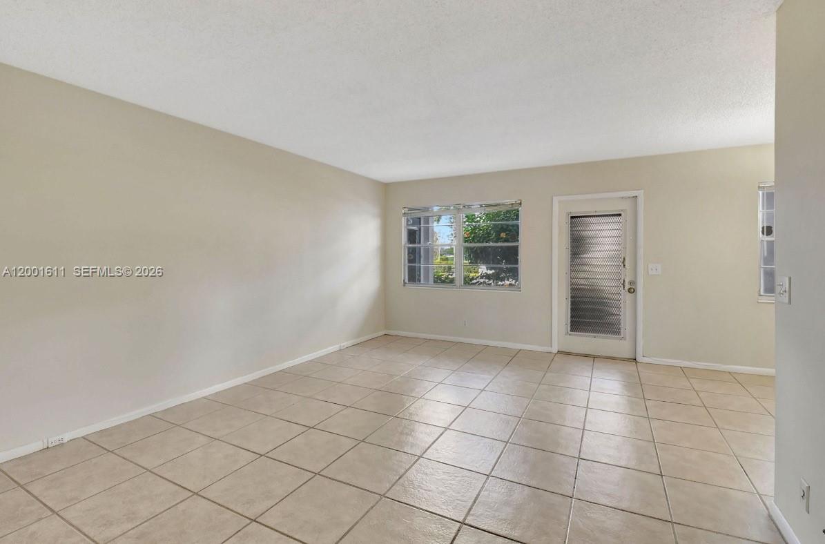 1020 Exeter, Unit 1020 Boca Raton, FL 33434 - Photo 8 of 15 an empty room with windows
