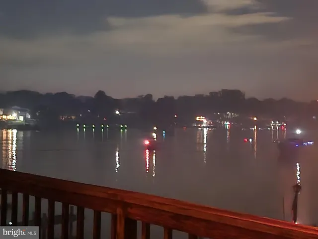 a view of a house with yard and mountain view