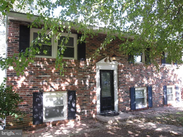 a view of a house with a tree
