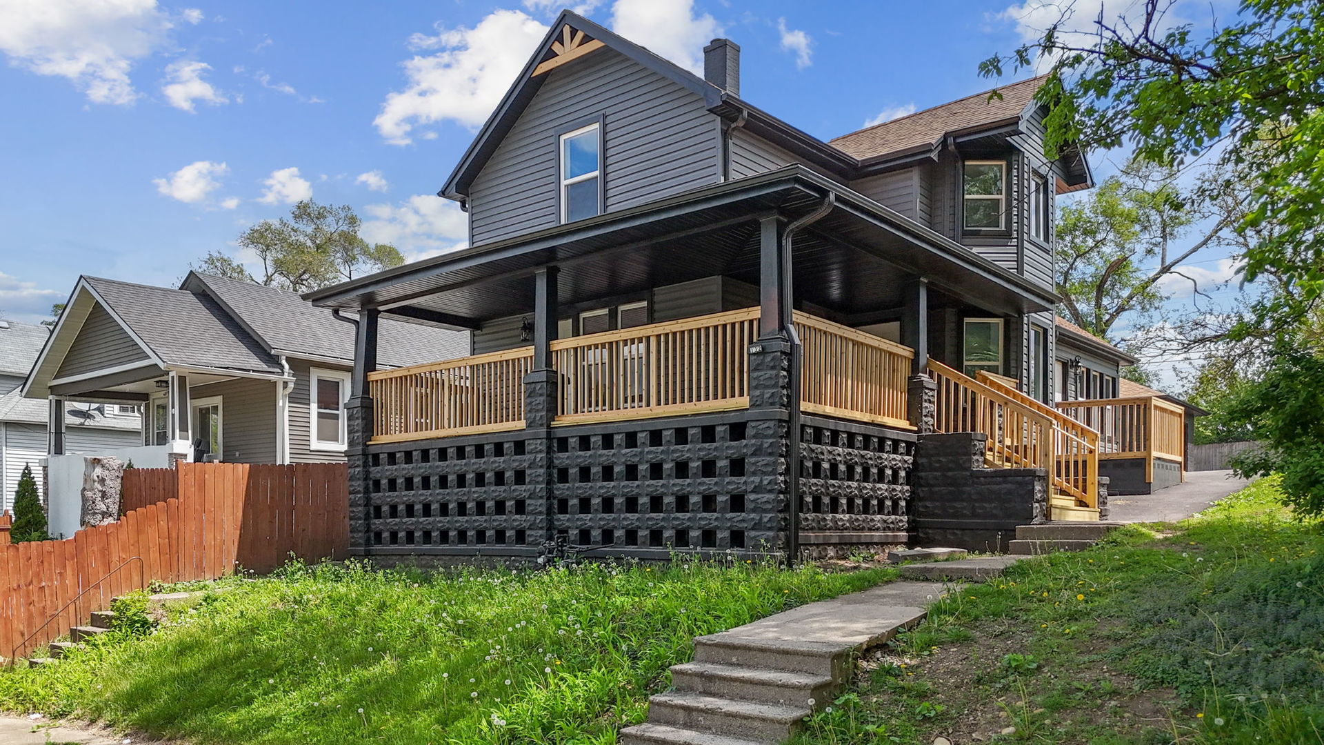132 Akin Avenue, Unit A Joliet, IL 60433 - Photo 1 of 3 a front view of a house with a garden