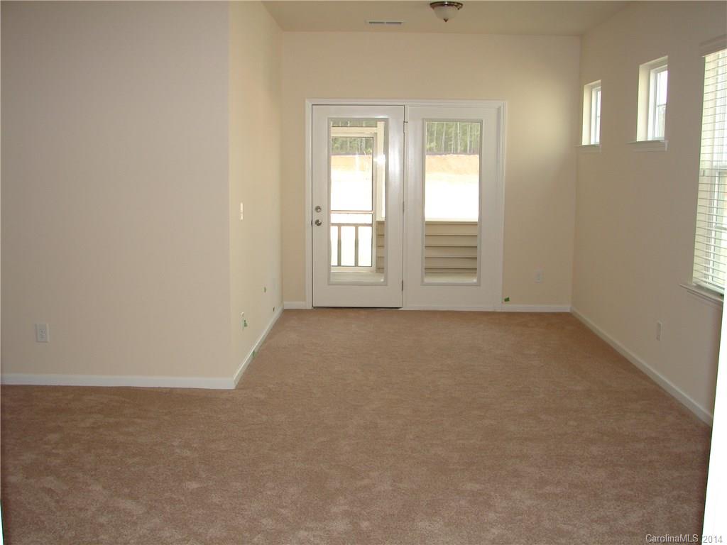 4316 Perth Road, Unit 290 Indian Land, SC 29707 - Photo 7 of 11 an empty room with windows