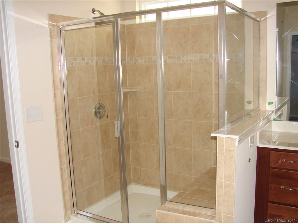 4316 Perth Road, Unit 290 Indian Land, SC 29707 - Photo 10 of 11 a bathroom with a granite countertop shower and a sink