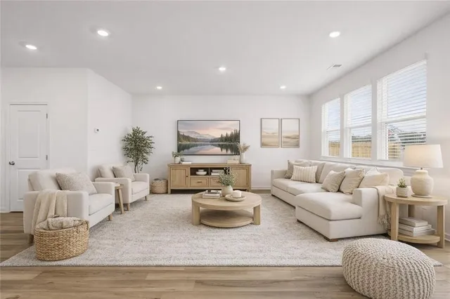 a living room with furniture and a large window