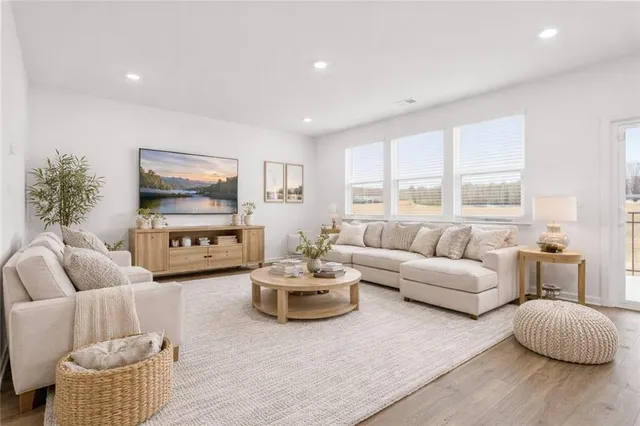 a spacious bedroom with a bed and a couch