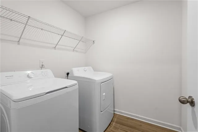 a backyard of a house with barbeque oven and glass door