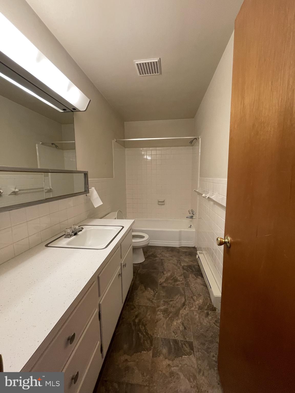 6 Orchard Hills Drive, Unit B Boyertown, PA 19512 - Photo 3 of 8 a bathroom with a sink and a mirror