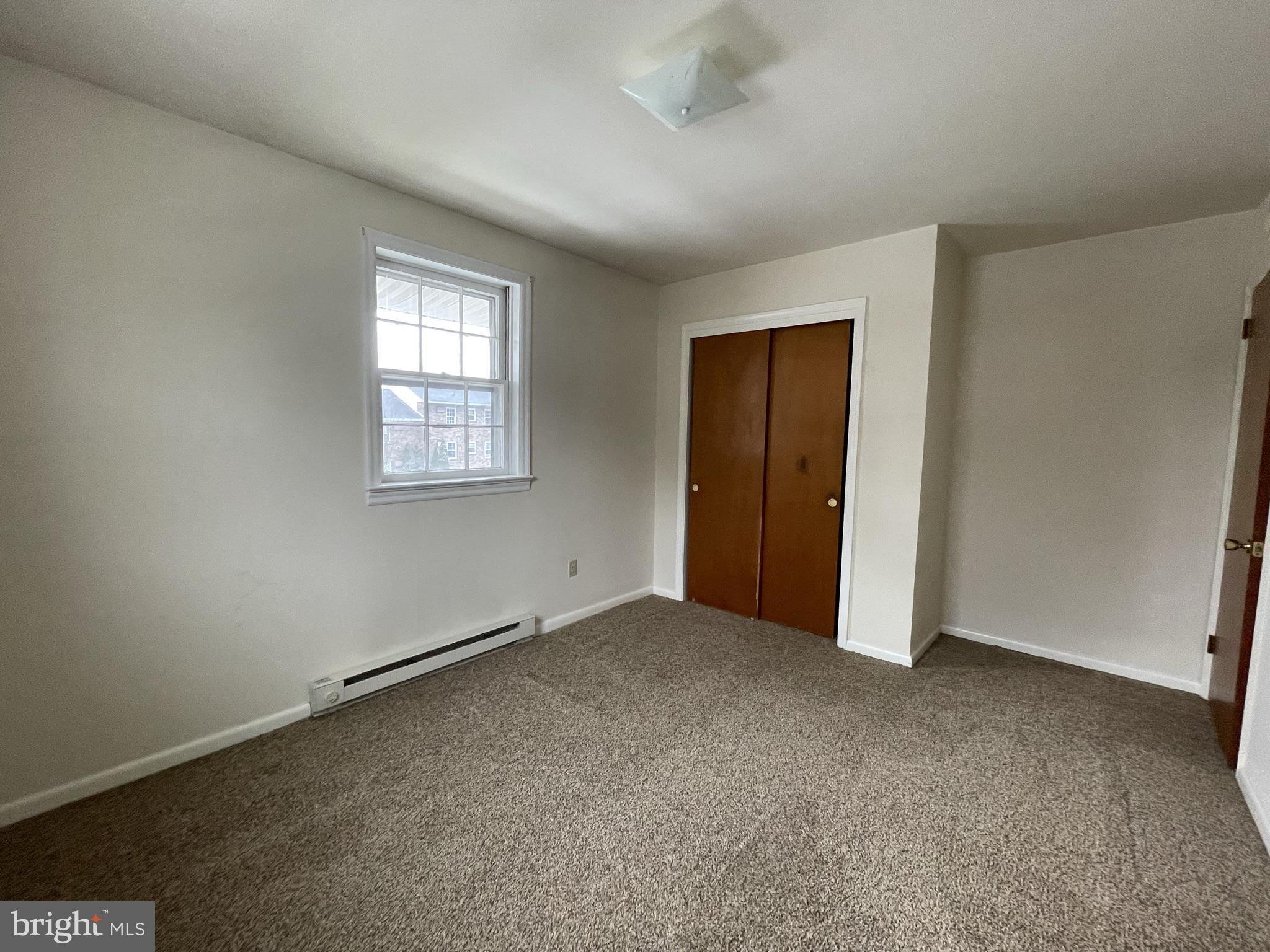 6 Orchard Hills Drive, Unit B Boyertown, PA 19512 - Photo 4 of 8 an empty room with windows