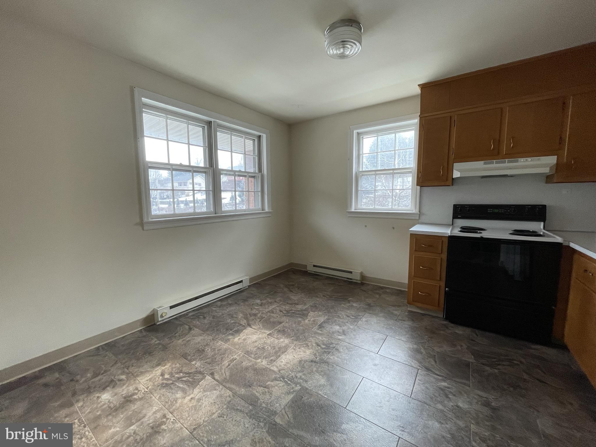 6 Orchard Hills Drive, Unit B Boyertown, PA 19512 - Photo 8 of 8 an empty room with windows