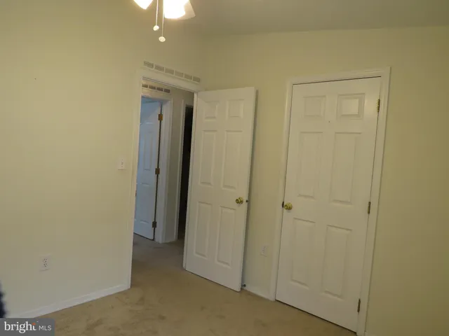 a view of a hallway with closet area