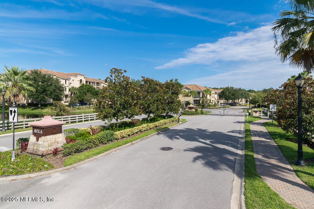 a view of a street with a yard