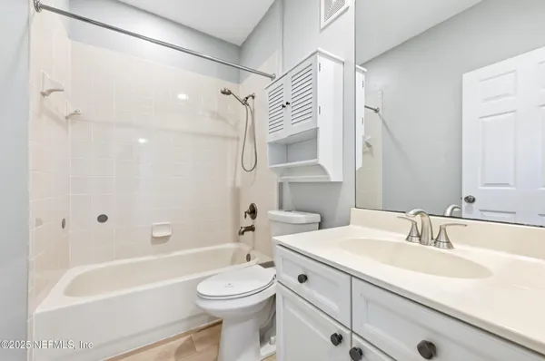 a bathroom with a sink a toilet and a bathtub