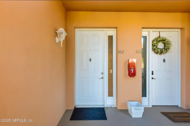 a view of room with window and wooden floor