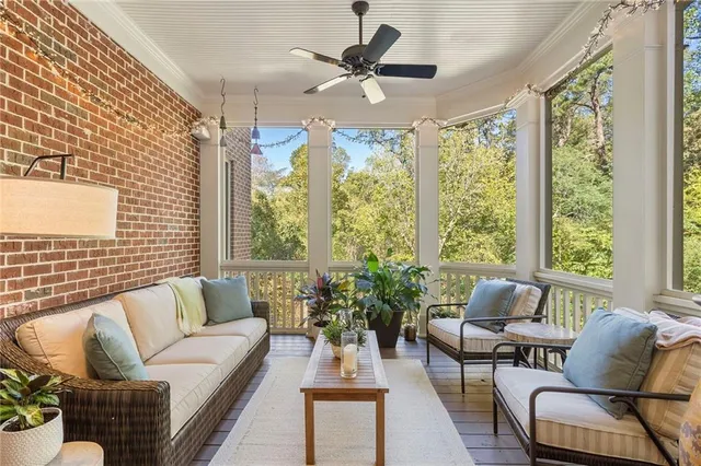a living room with furniture a rug and a window