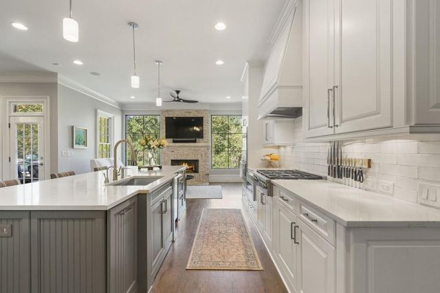 a view of a deck with table and chairs with wooden floor and fence