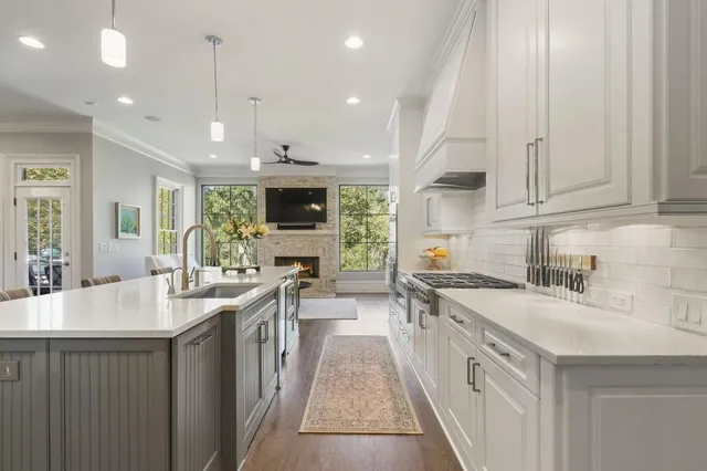 a view of a deck with table and chairs with wooden floor and fence