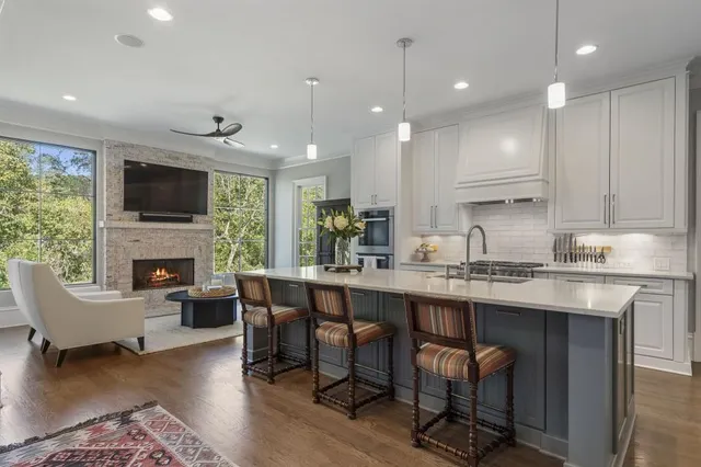 a view of a chairs and table in the backyard