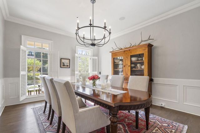 a large kitchen with a table and chairs