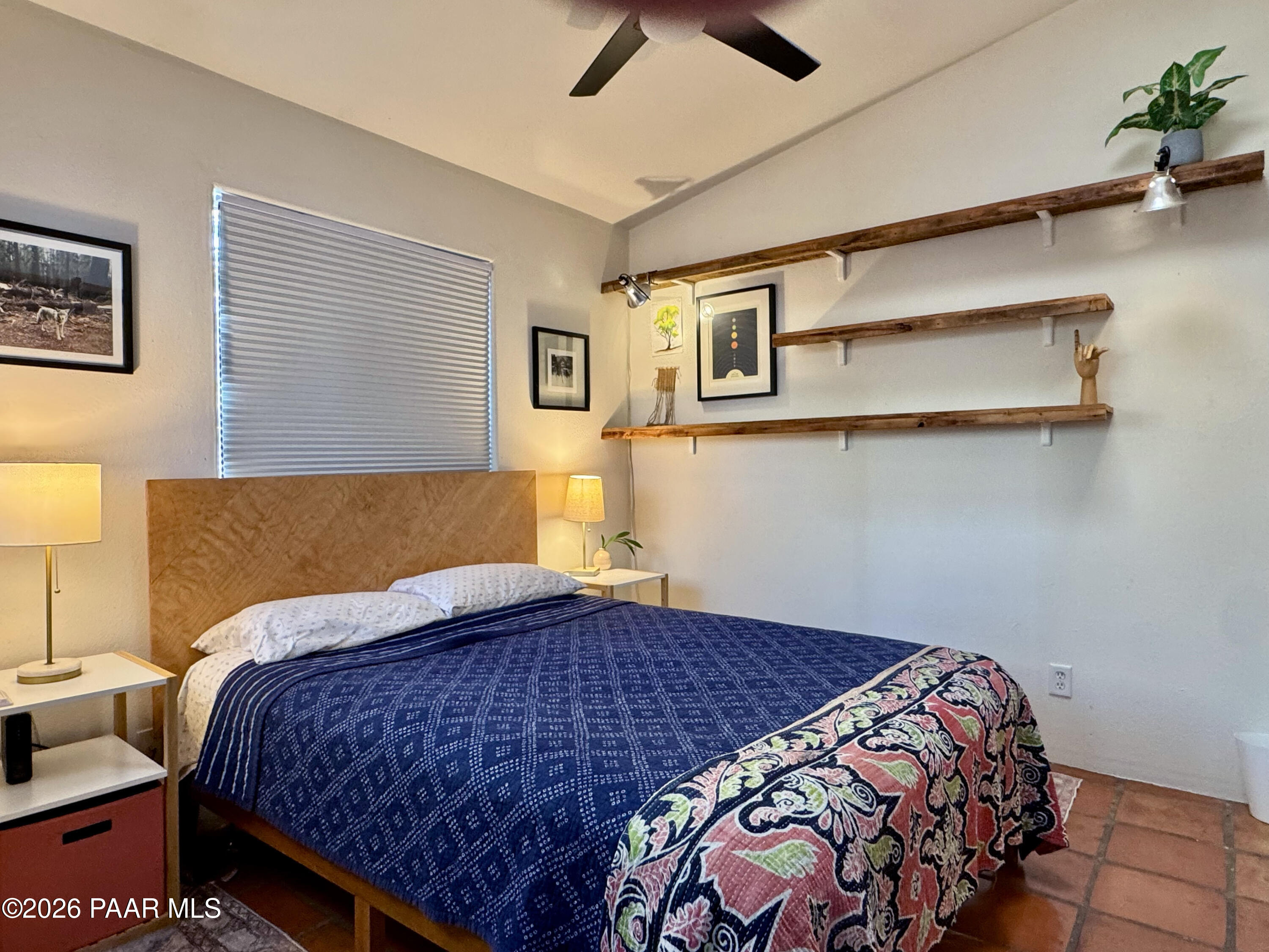 815 Ruth Street Prescott, AZ 86301 - Photo 29 of 30 a bedroom with a bed and a painting on the wall