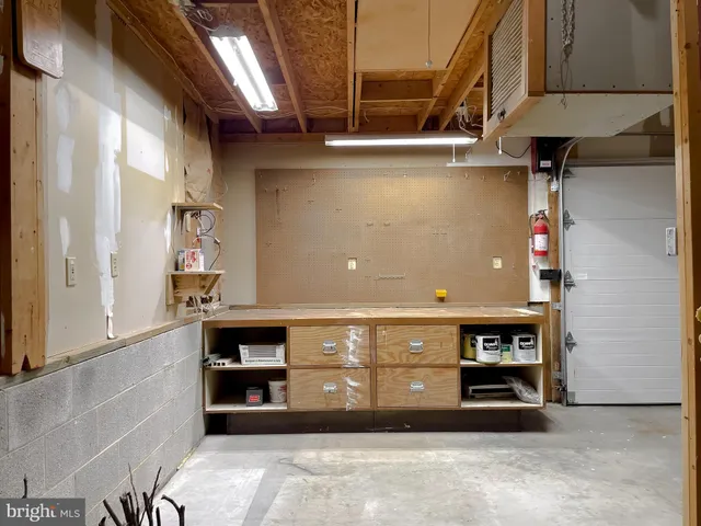 a view of an empty room with a fireplace