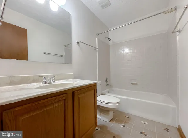 a bathroom with a sink a toilet and a bathtub