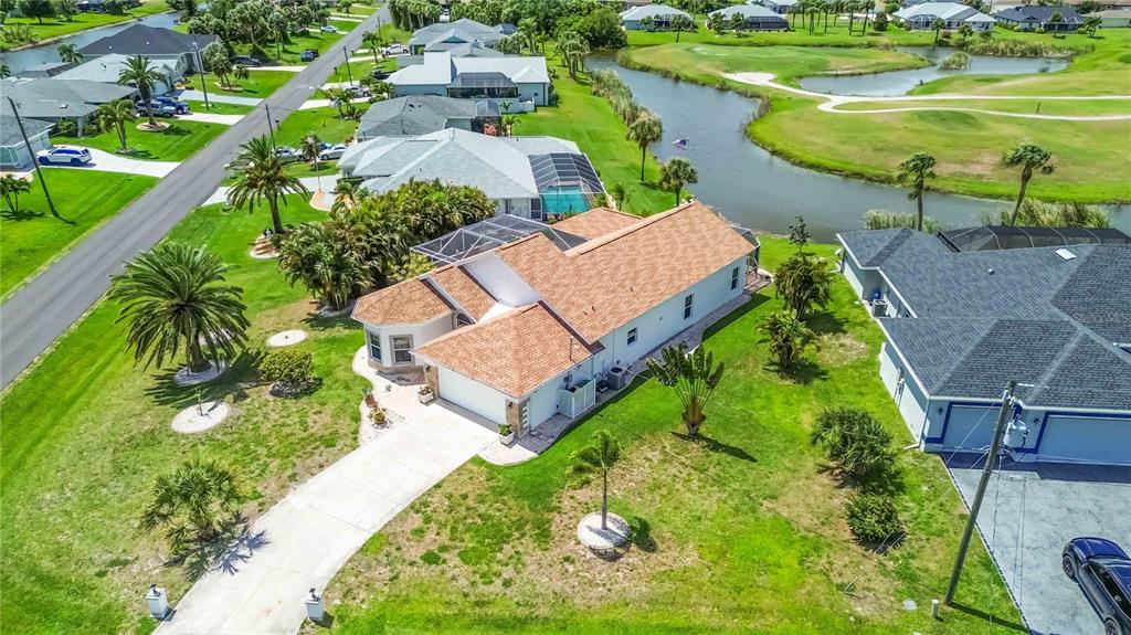 48 Bunker Road Rotonda West, FL 33947 - Photo 52 of 59 an aerial view of a house with outdoor space pool patio and lake view