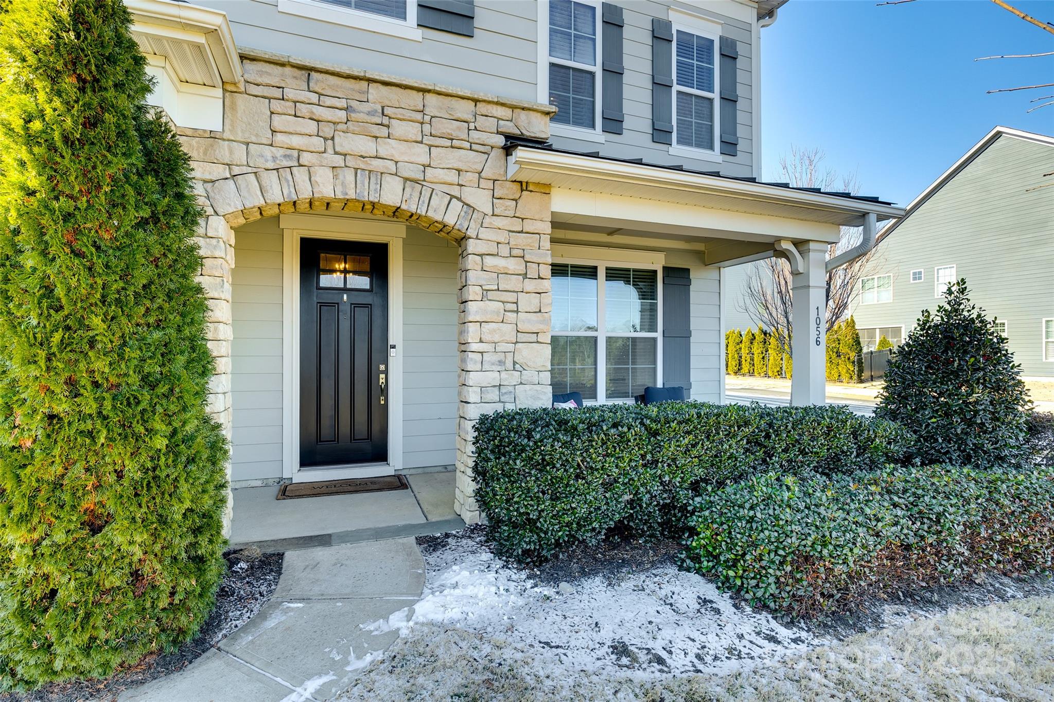 1056 Emory Lane Fort Mill, SC 29708 - Photo 2 of 48 a front view of a house with garden