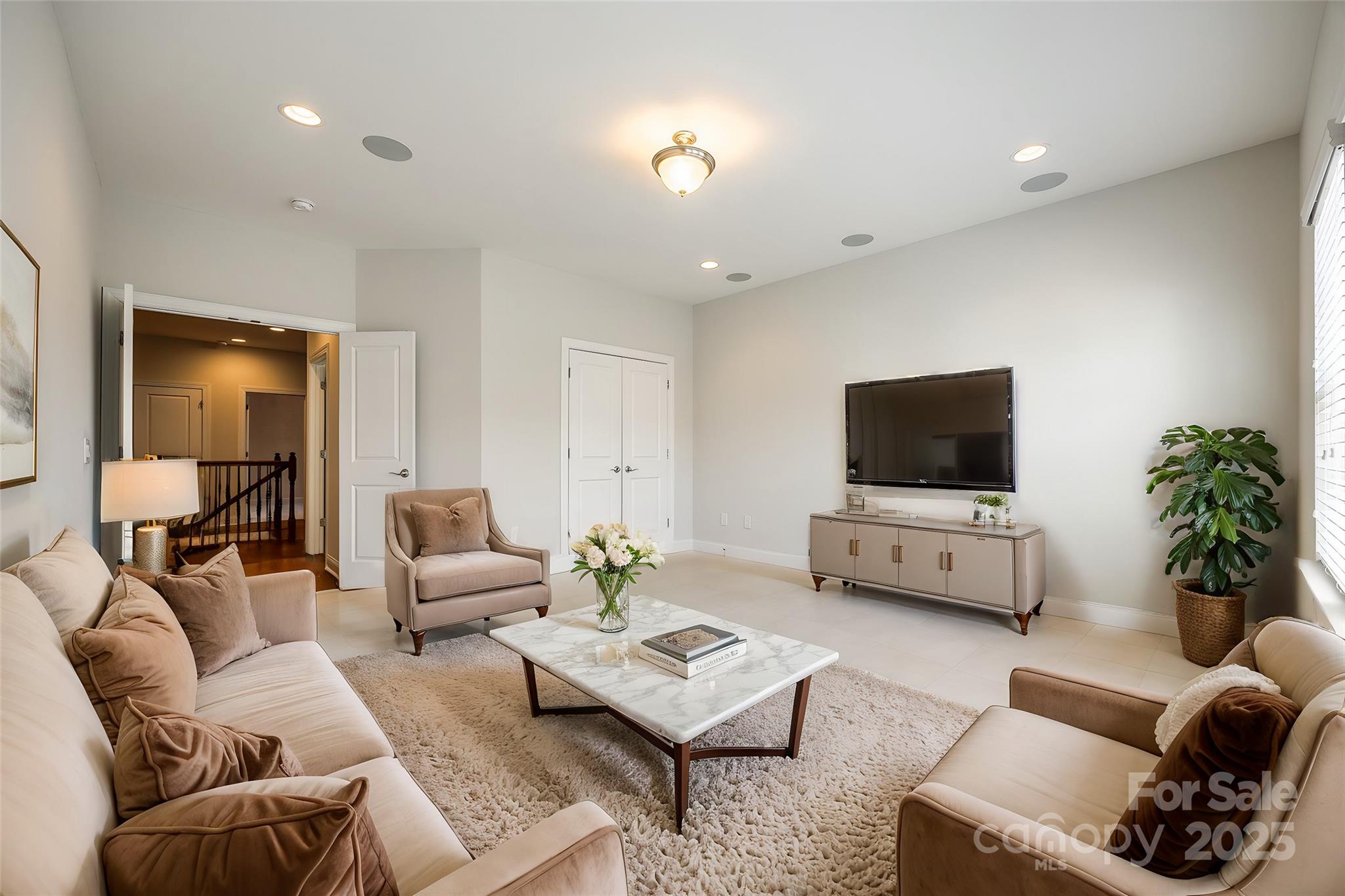 1056 Emory Lane Fort Mill, SC 29708 - Photo 34 of 48 a living room with furniture and a flat screen tv