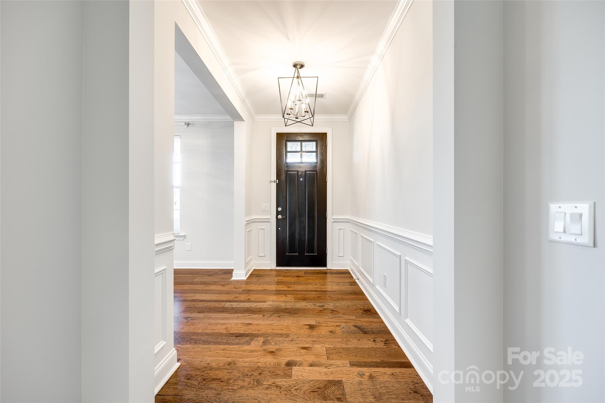 1056 Emory Lane Fort Mill, SC 29708 - Photo 4 of 48 a view of a hallway with wooden floor and staircase