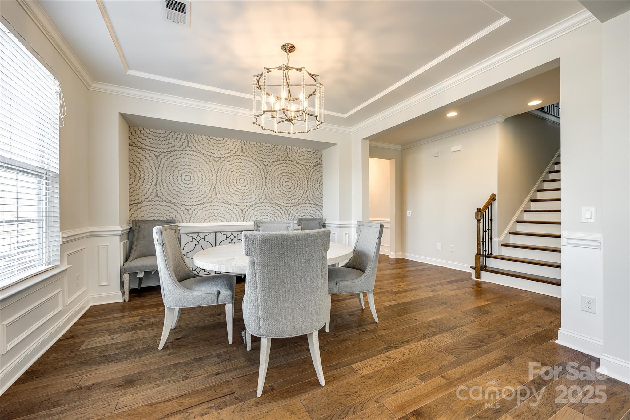 1056 Emory Lane Fort Mill, SC 29708 - Photo 6 of 48 a view of a dining room with furniture wooden floor and chandelier