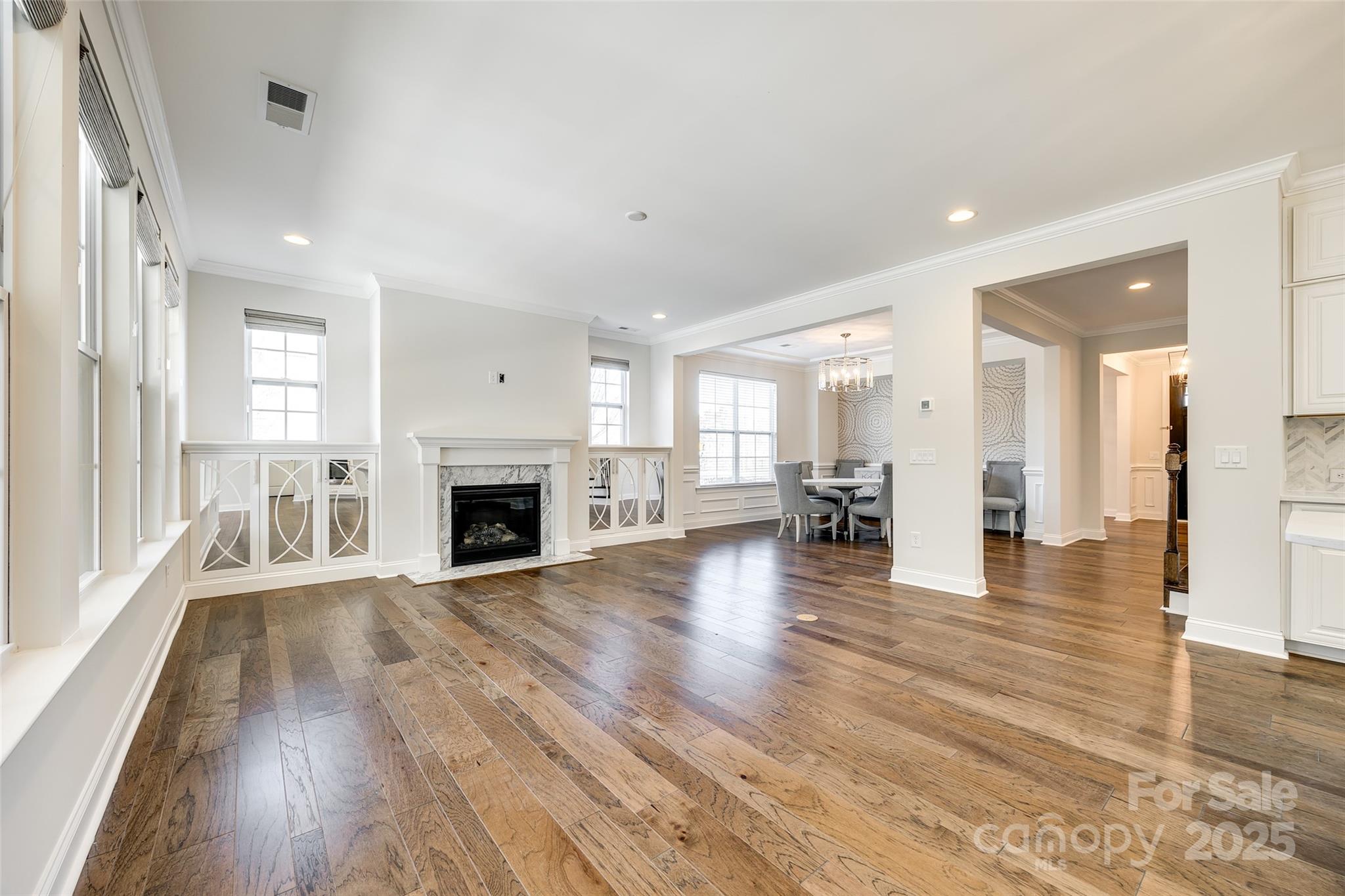 1056 Emory Lane Fort Mill, SC 29708 - Photo 9 of 48 a view of a livingroom with wooden floor and a fireplace