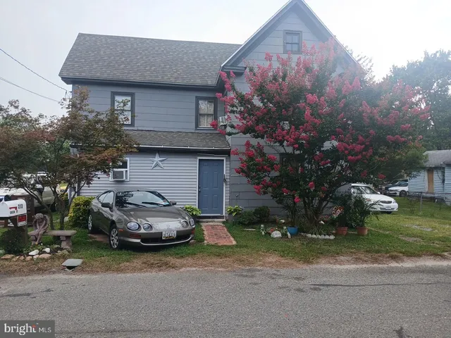 a car parked in front of a house