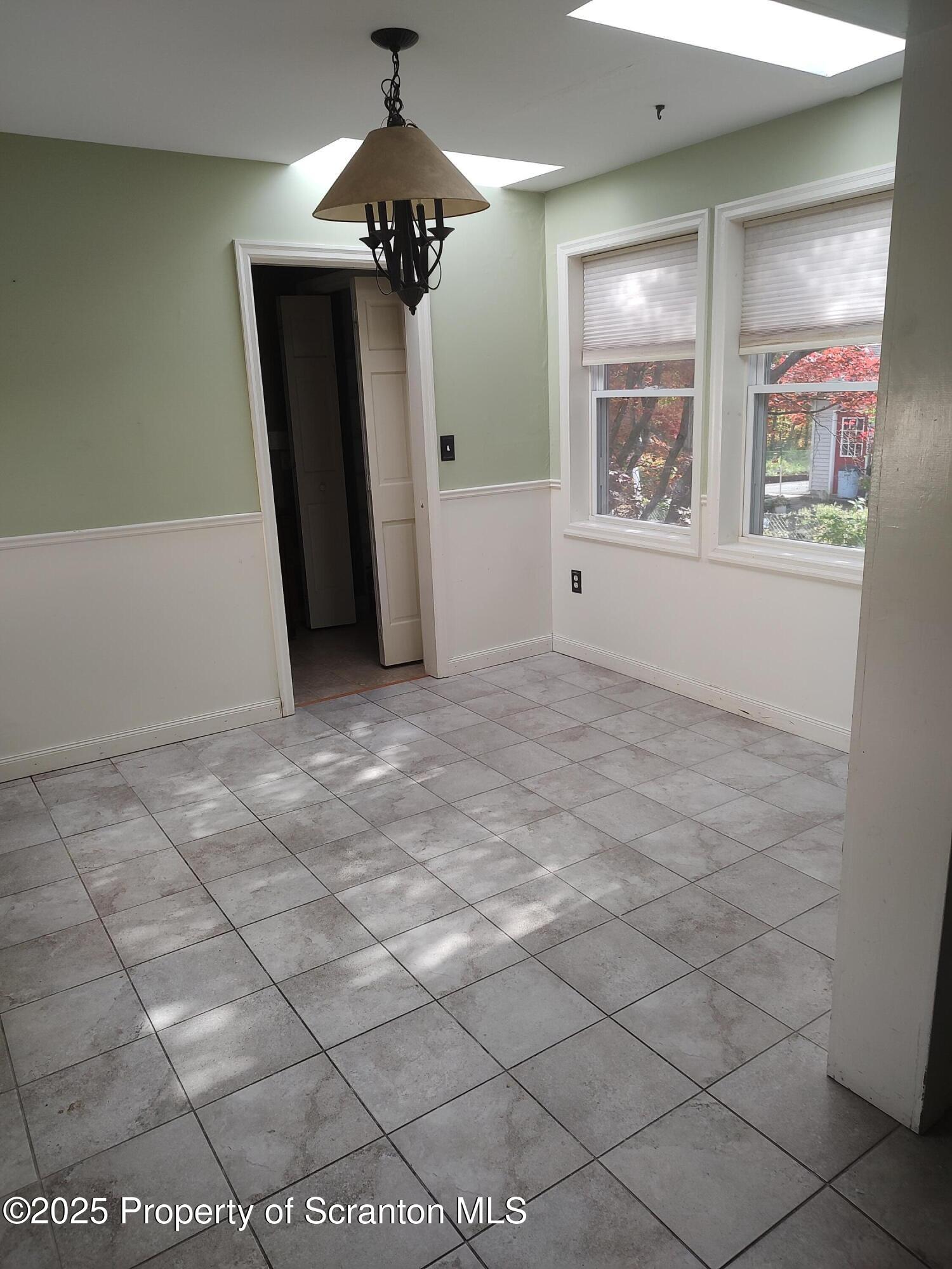 215 West Grove Street Clarks Summit, PA 18411 - Photo 16 of 26 a view of an empty room with a window