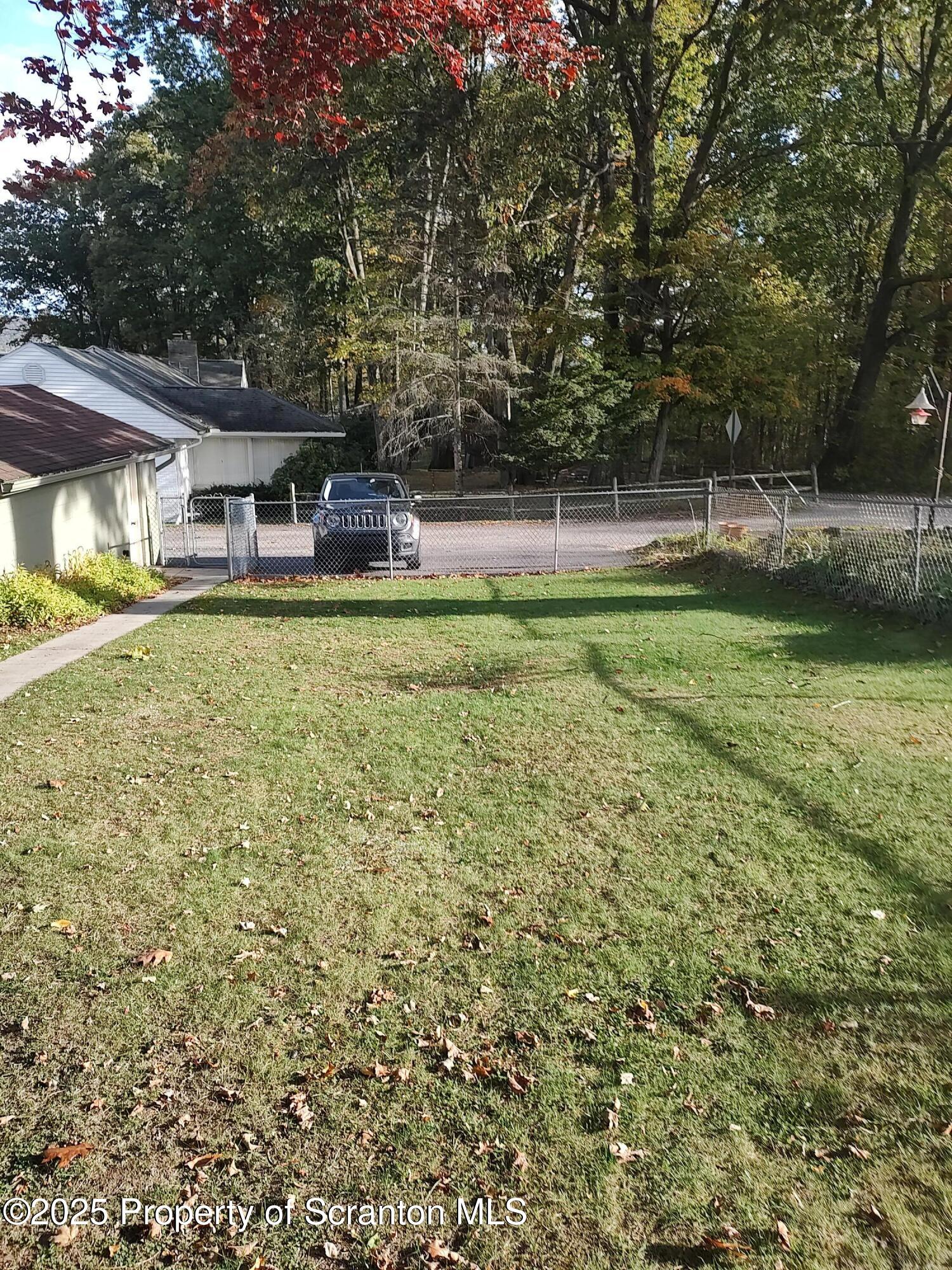 215 West Grove Street Clarks Summit, PA 18411 - Photo 7 of 26 a front view of a house with garden